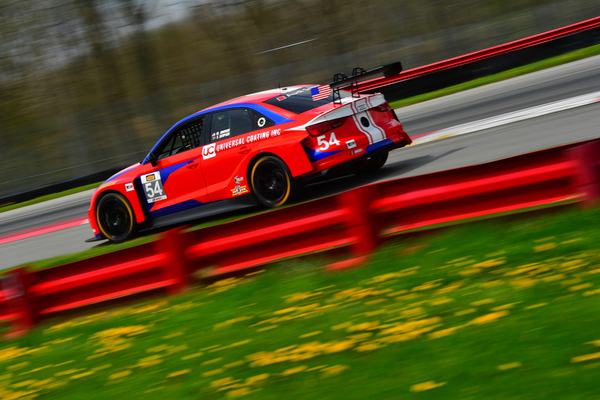 The red and blue #54 Audi TCR at speed, 2018