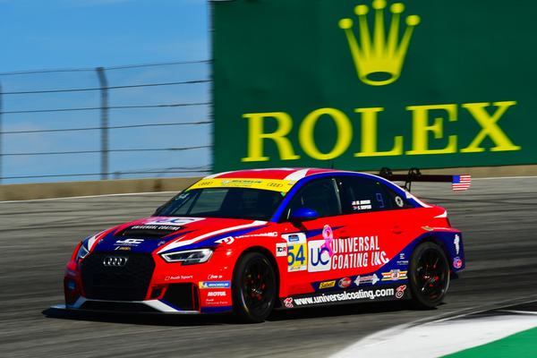 The #54 Universal Coating Audi passing the Rolex sign, 2019